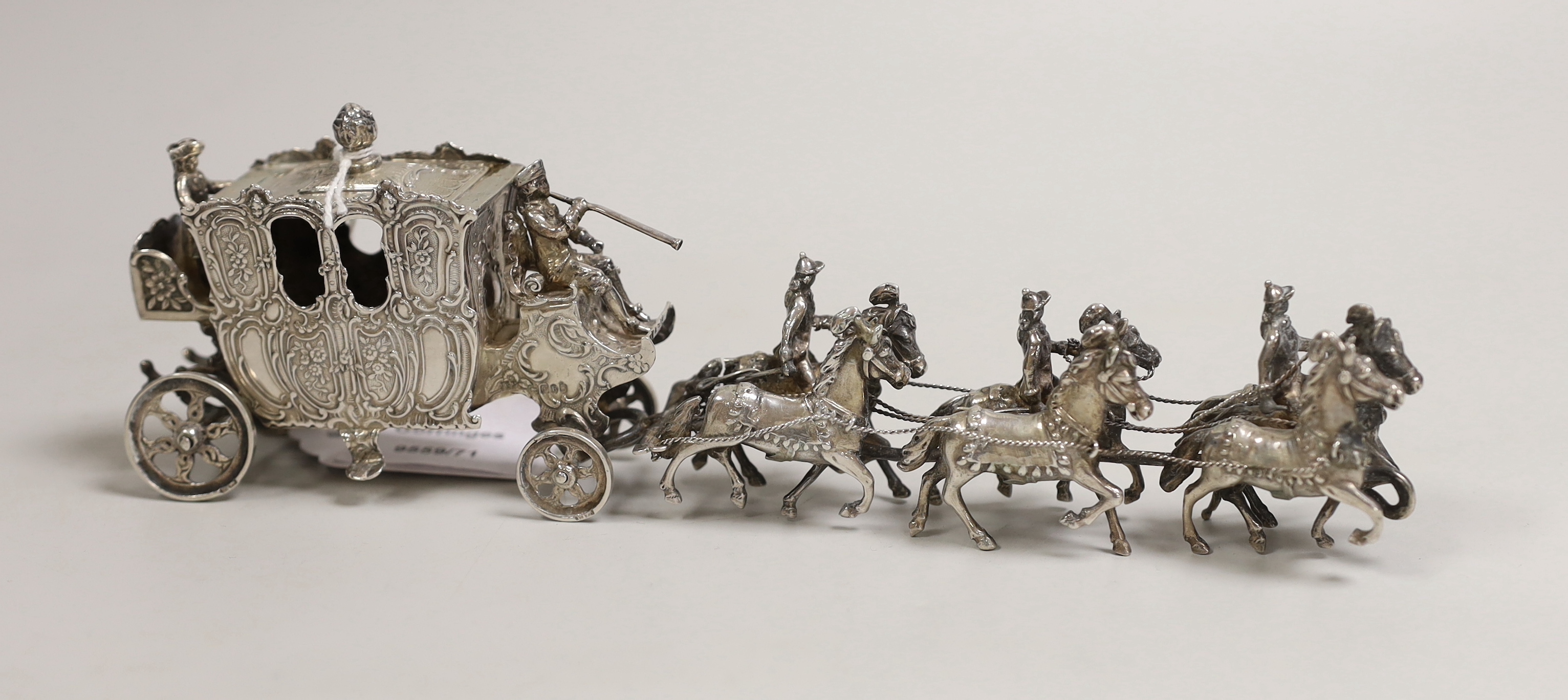 An Edwardian Hanau silver model of a coaching procession, import marks for London, 1901, length 24cm, 10.9oz.